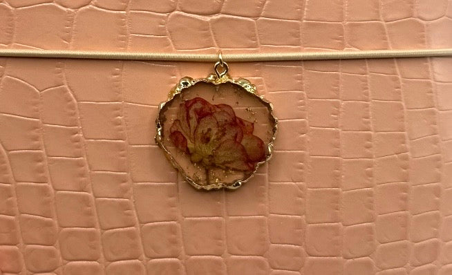 Soft blush A5 embossed with a subtle crocodile texture. Delicate gold charms and preserved nature.