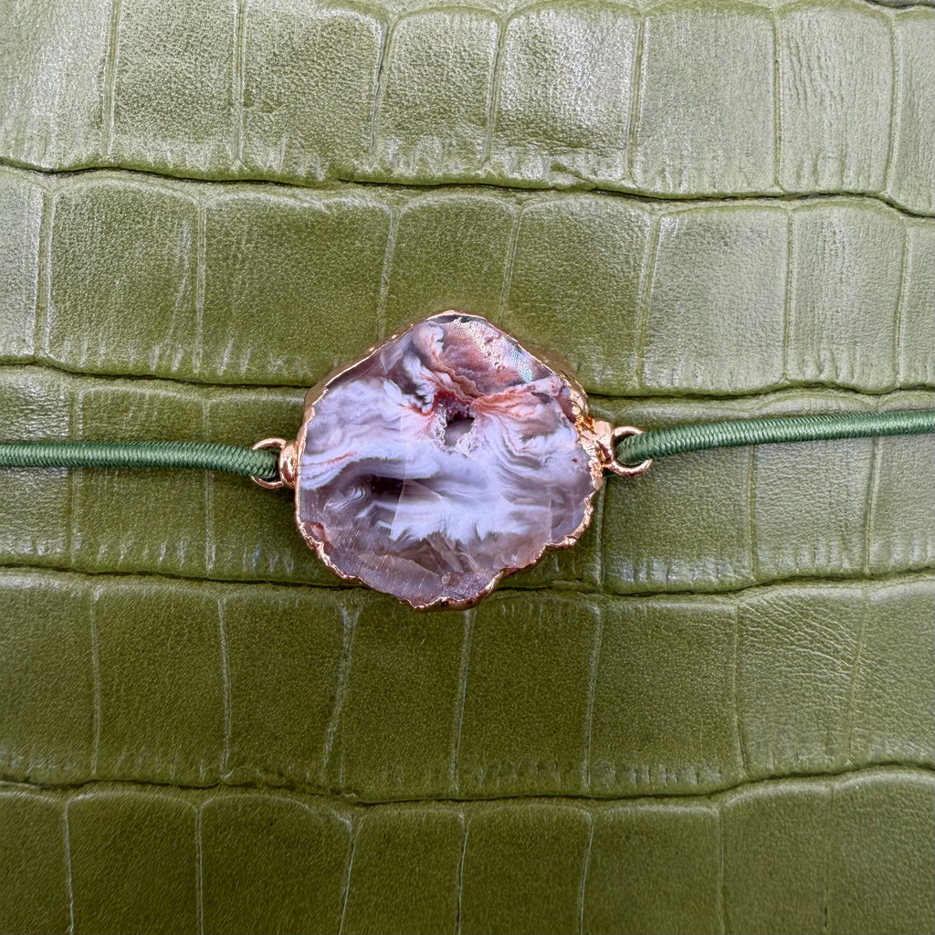 Luminous soft green moss, embossed in crocodile texture, distinctive elegance.