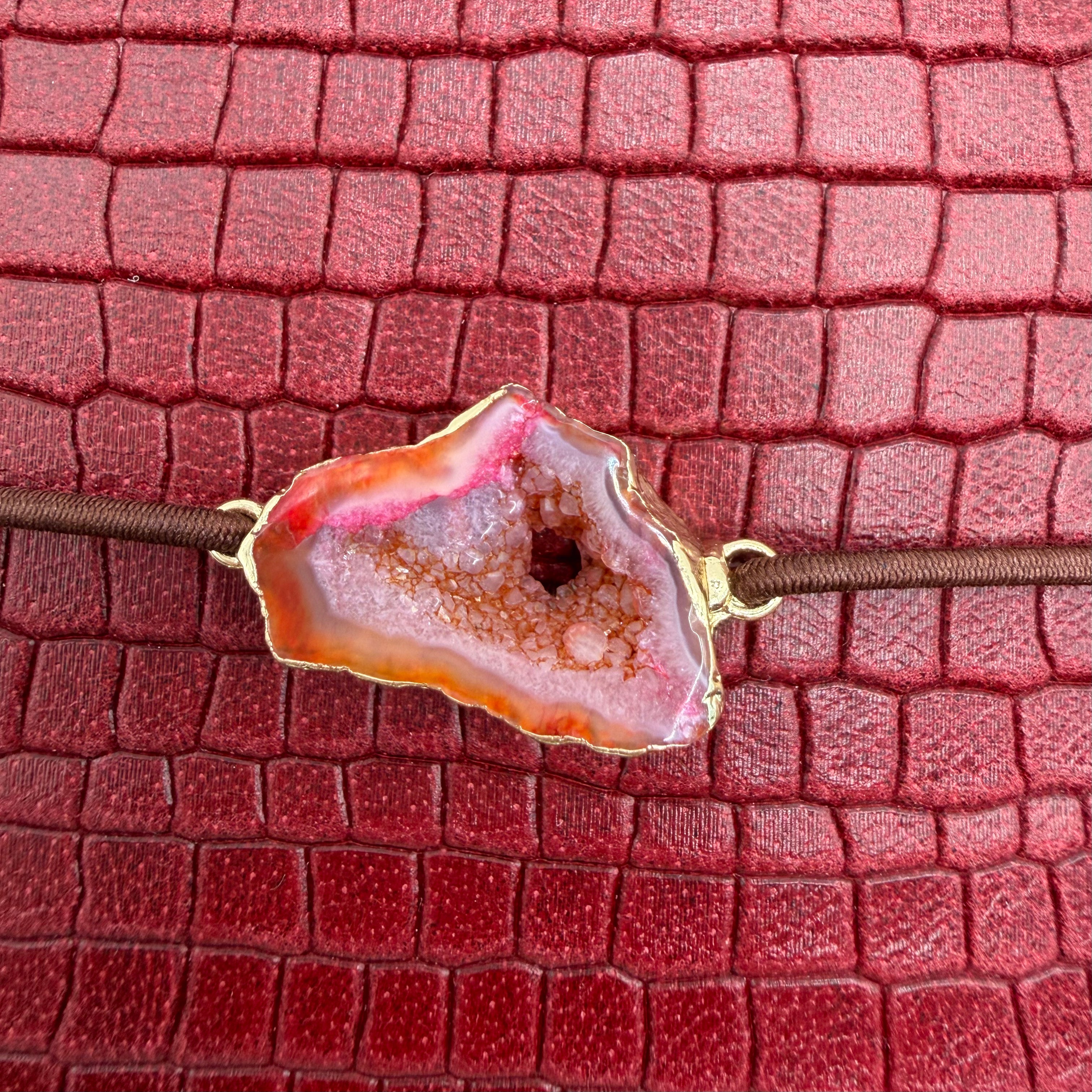 Deep crimson red, in embossed crocodile texture that radiates bold elegance.