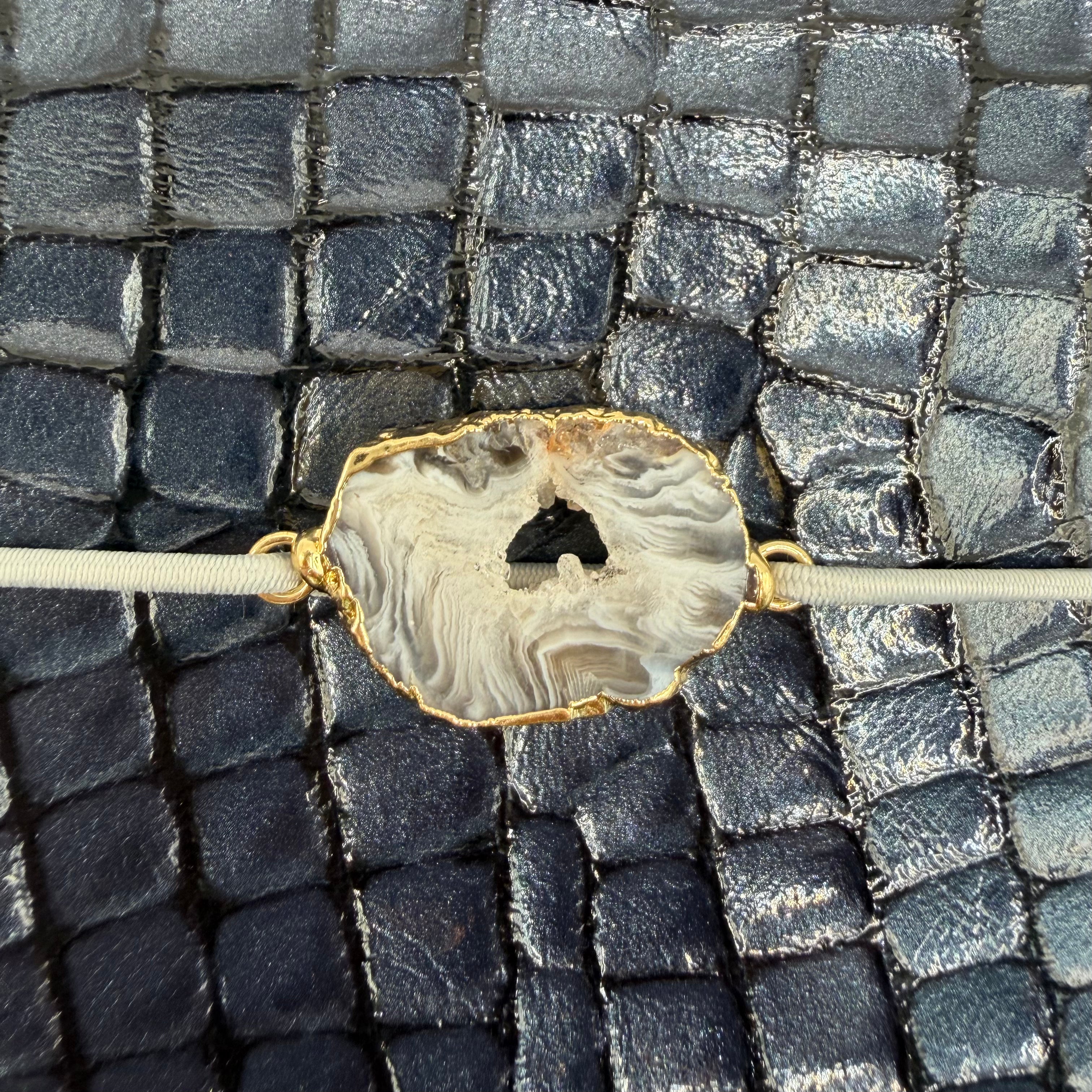 Deep midnigh blue, with embossed crocodile texture, timeless elegance.
