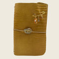 Amber glow A5 in rich caramel leather captures the warmth of sunlight tones organic beauty.