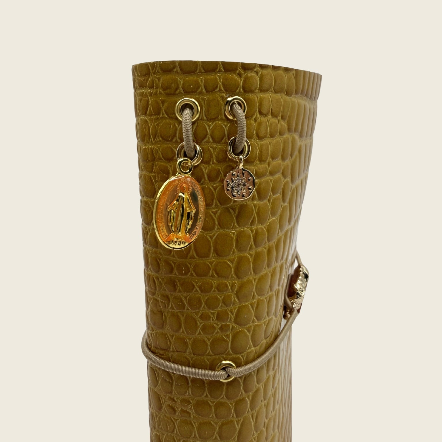Mini Amber glow A6 Rich golden leather embossed with crocodile texture. Nature stone center piece, depth, light and quiet luxury.