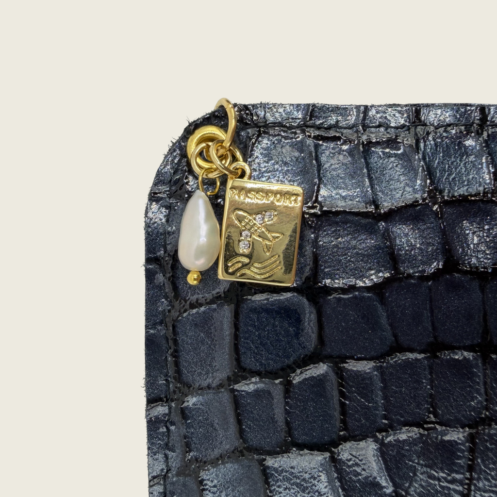 Deep midnigh blue, with embossed crocodile texture, timeless elegance.