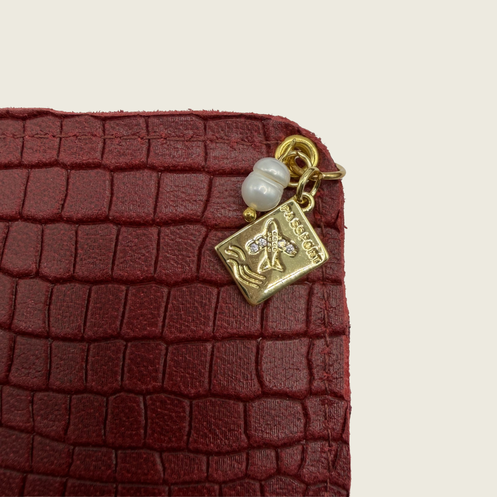 Deep crimson red, in embossed crocodile texture that radiates bold elegance.