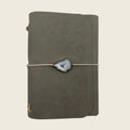 Mini Moonlight A6 Soft matte Greig leather, with a lace trace hand-punched dots. Timeless in luxury.