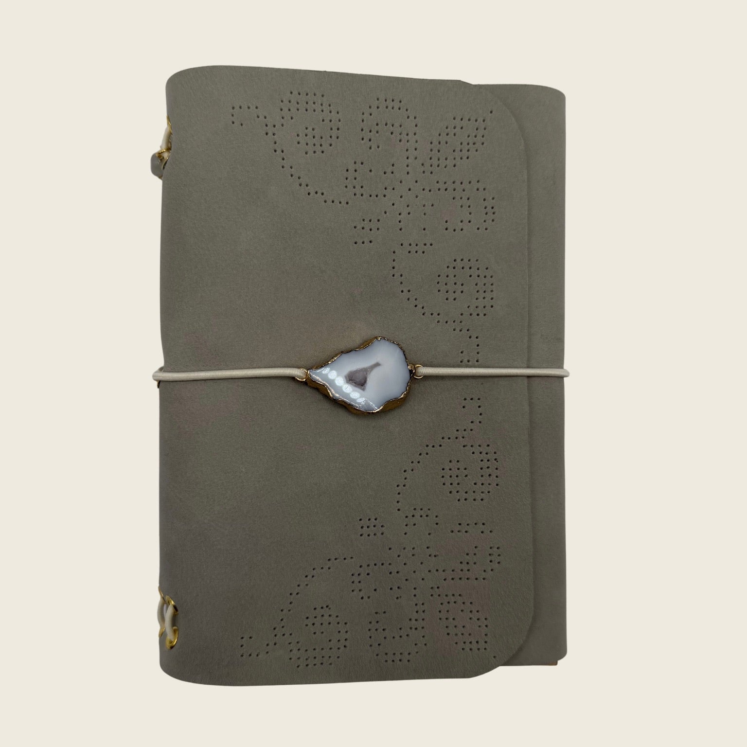Mini Moonlight A6 Soft matte Greig leather, with a lace trace hand-punched dots. Timeless in luxury.