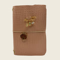 Soft blush A5 embossed with a subtle crocodile texture. Delicate gold charms and preserved nature.